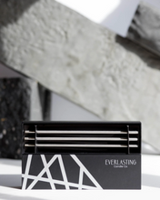 Load image into Gallery viewer, The Everlasting Candle color Champagne is a warm and rosy shade creating a relaxing, homely atmosphere with added expression and extravagance. An elegant and unique steel oil candle that doesn't melt down. Product Highlights Made of steel Doesn't burn down 8 inches in length