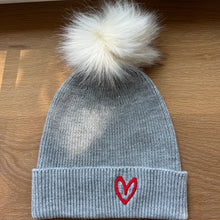 Load image into Gallery viewer, HOUSE OF SHAN-IMPERFECT HEART POM HAT IN GREY

